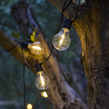 Anschließbare Außenlichtgirlande 10 warmweiße LED-Kugeln transparent PARTY CLEAR HYBRID 7,50m solar- und netzbetrieben